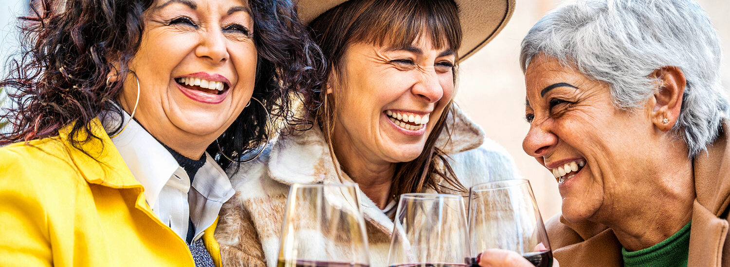 3 women with wine in Italy