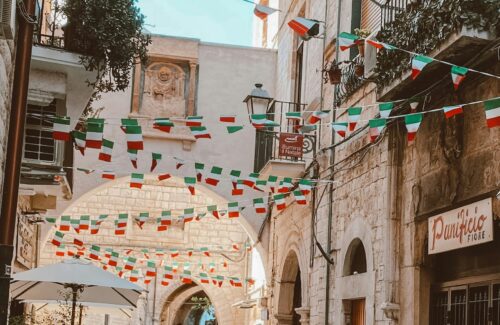 streetscape in bari with flag bunting
